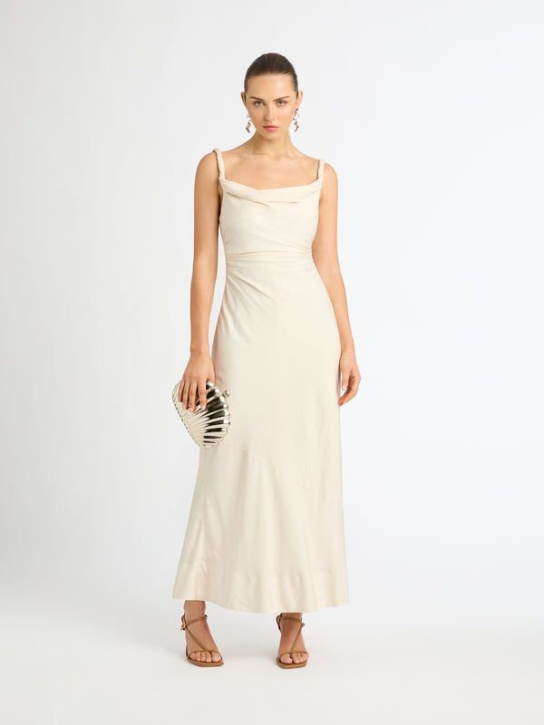 ANGELINA MIDI DRESS IN VANILLA WITH TWISTED STRAPS FRONT IMAGE WITH CLUTCH