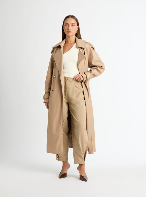 SOLAR TRENCH COAT ALMOND FRONT IMAGE STYLED WITH LONG PANTS