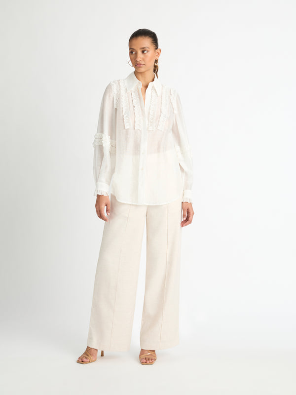 MYSTIQUE RUFFLE SHIRT IN WHITE FRONT ANGLE SHIRT UNTUCKED