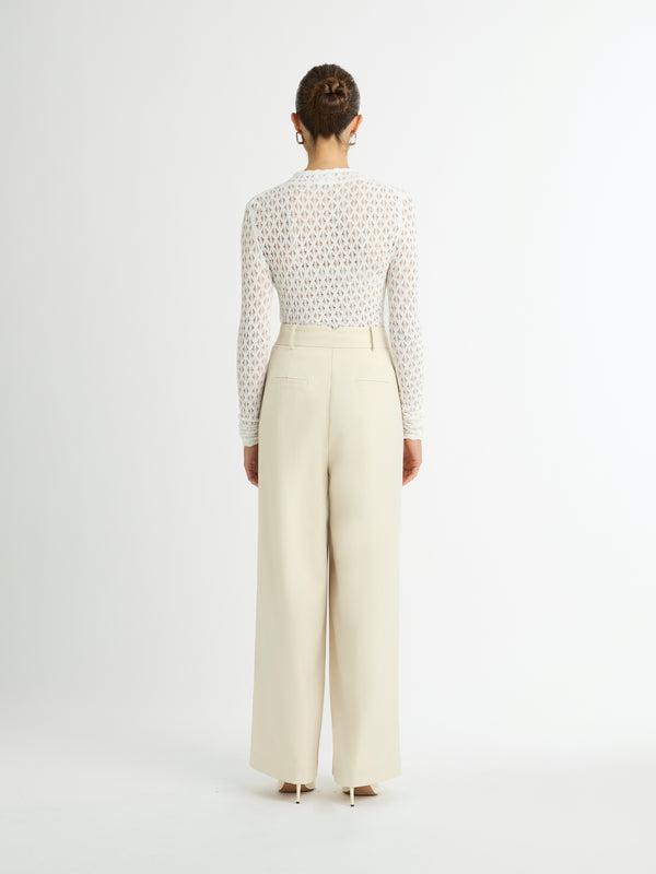 DIVISION KNIT TOP IN WHITE BACK IMAGE STYLED