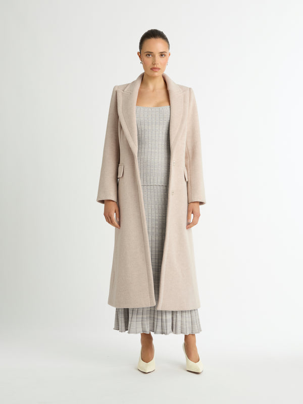 ARIEL LONGLINE COAT IN NEUTRAL FRONT IMAGE STYLED WITH SKIRT